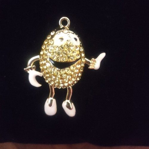 The Smiling Child pendant necklace like new, gold with white enamel