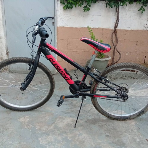 Mountain bike 24 inch used, red, with gears and V-brakes