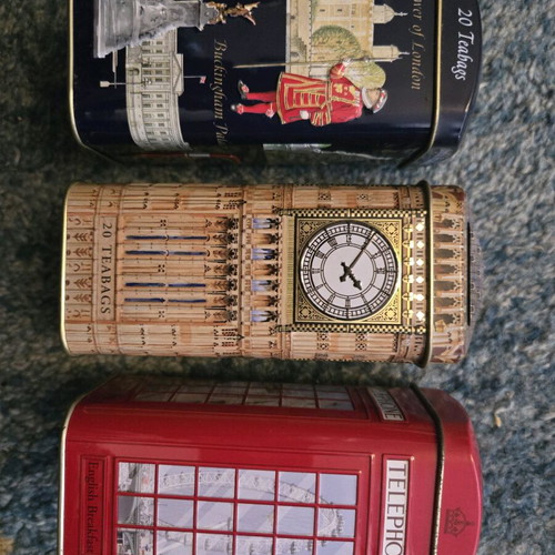Set of three tin piggy banks like new from England