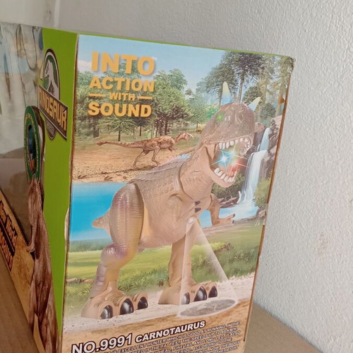 Dinosaur toy like new, in original box with minor wear