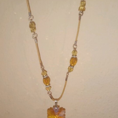Handmade necklace with amber beads and leaf pendant