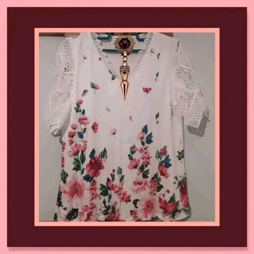 White blouse with floral design and lace sleeves