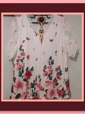 White blouse with floral design and lace sleeves