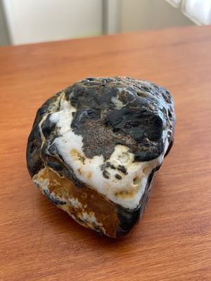 Volcanic rock with white quartz vein and natural iron oxidations