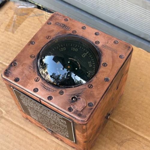 Old copper submarine compass used with artificial horizon