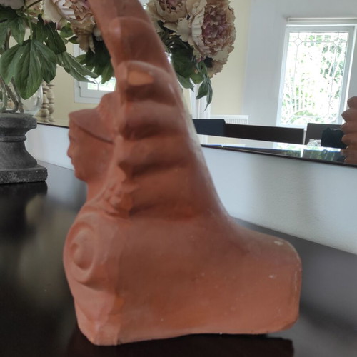 Traditional clay acroterion (anthemion) depicting the form of the God Hermes
