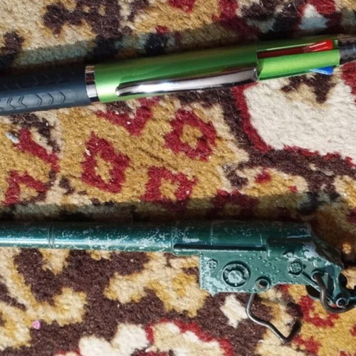 Green metal cannon from 1970s tank used