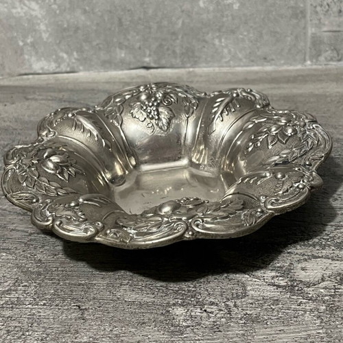 Decorative metal bowl used with embossed design