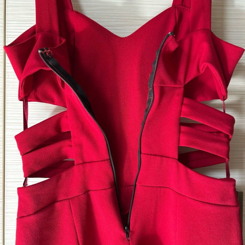 Red one-piece jumpsuit like new with side cutouts and bust support