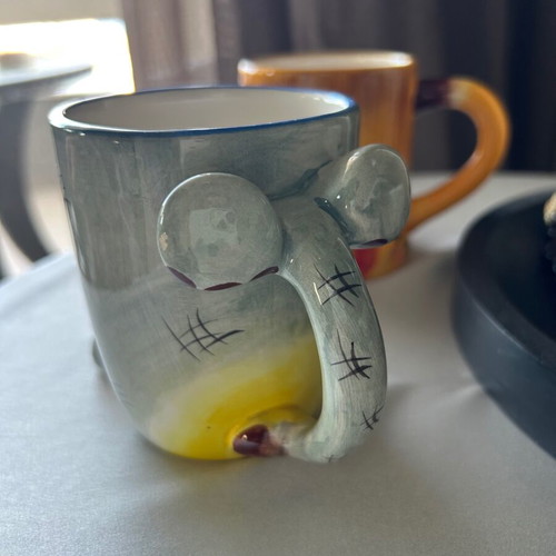 Children's ceramic mugs used, vintage with embossed elephant and lion