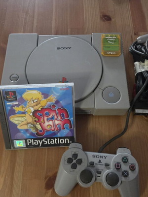 Sony PlayStation 1 console used with memory card, controller, and game