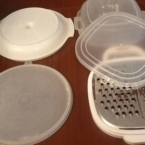 Set of three kitchen containers and stainless steel grater