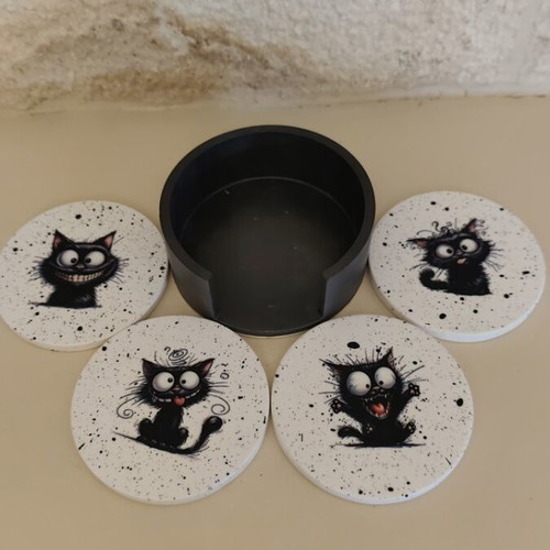 Handmade coasters with black base and 4 playful cat designs