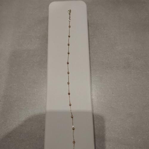 9k gold bracelet with diamond-studded beads