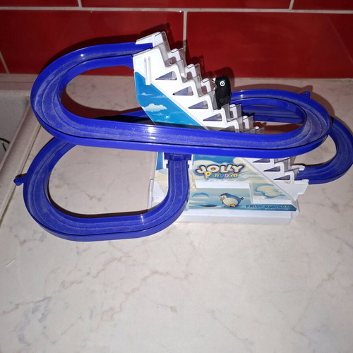 Penguin climbing stairs used toy