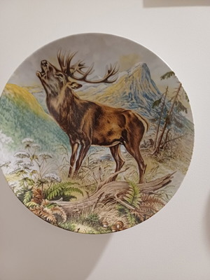 Vintage porcelain plate by Kaiser with deer illustration used