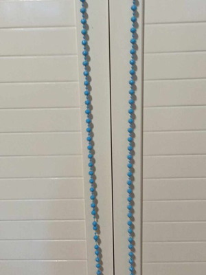 Necklace used blue worn tied and can be used as belt