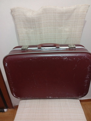 Vintage travel suitcase used, burgundy leather exterior