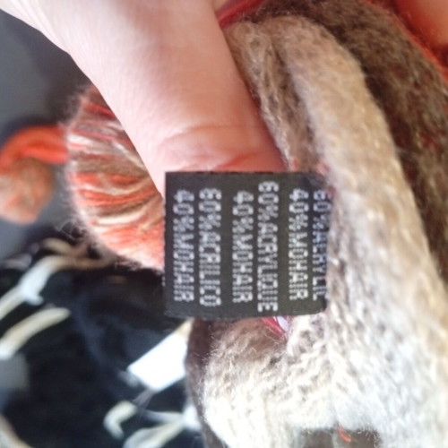 Set of 2 knitted Sprider scarves like new, black and white and orange with pom-poms