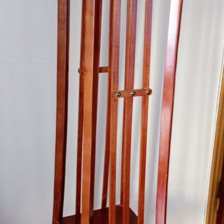 Handcrafted tall wooden plant stand with carved floral details