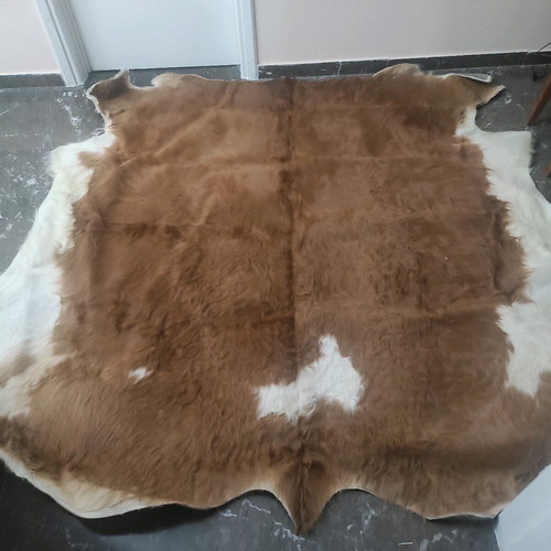 Cowhide rug like new, brown with white