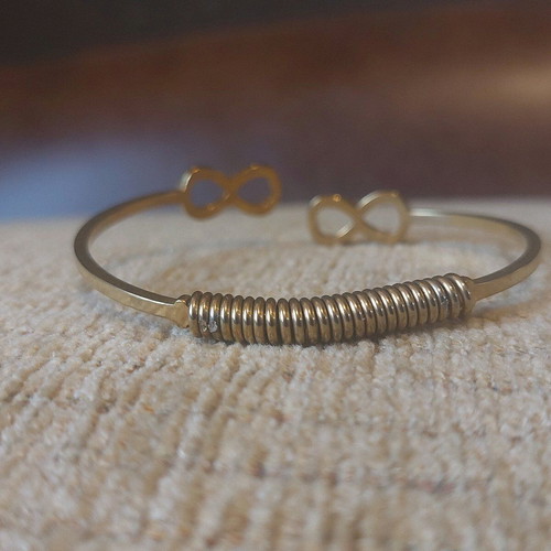 Gold infinity handcuff bracelet like new