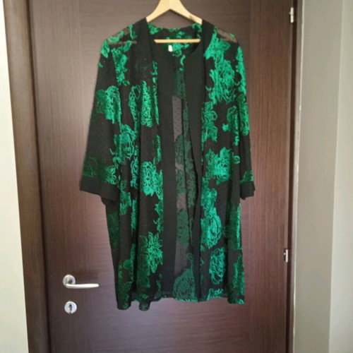 Women's tunic like new, black with green flowers