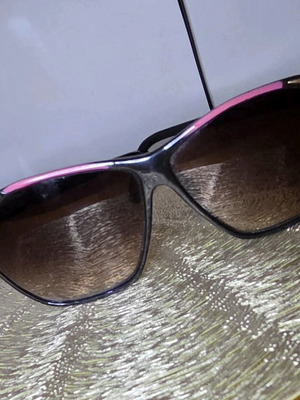 Sunglasses used, black and pink
