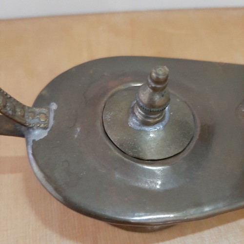 Copper oil lamp used with carved decorations and patina
