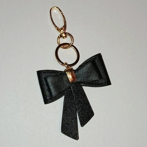 Bow keychain like new, black and gold