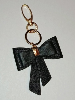 Bow keychain like new, black and gold