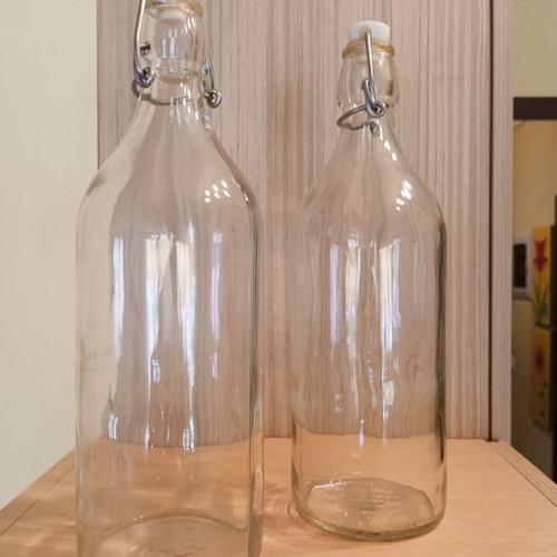 Set of 2 glass bottles with safety cap IKEA like new