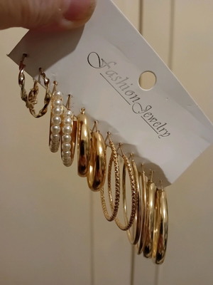 Earrings pack unused, many together, gold-colored