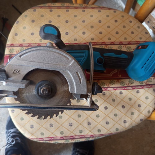 Cordless circular saw with two batteries and charger