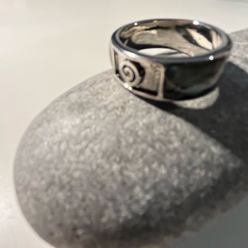 Steel ring with inlaid abalone shell details