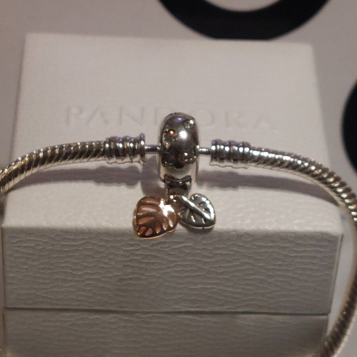 Pandora bracelet size 18 with round clasp and two leaf charms