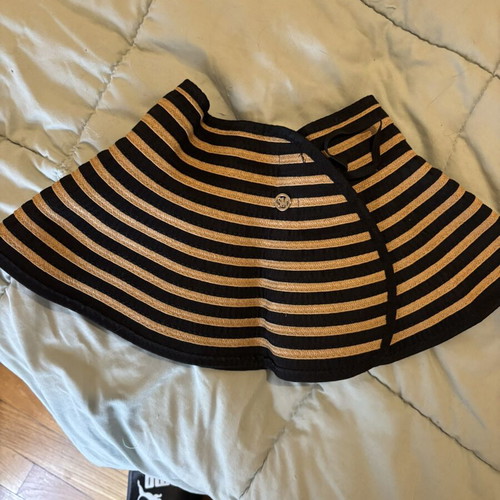 Steve Madden bucket hat with striped design and adjustable opening for ponytail