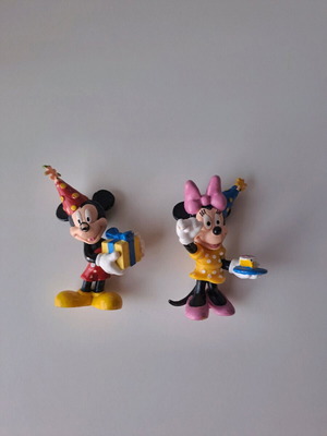 Disney Mickey and Minnie figures used with party hats
