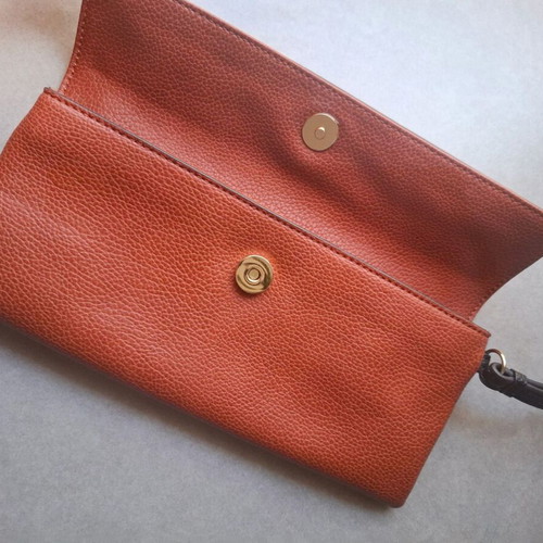 KEM wristlet clutch like new, burgundy embossed faux leather