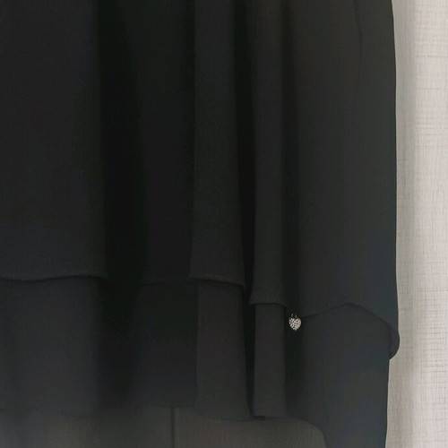 Sleeveless women's blouse black like new with ruffles and sheer detail