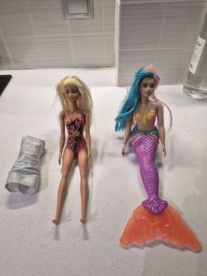 Barbie dolls used with dress gift, mermaid and swimsuit