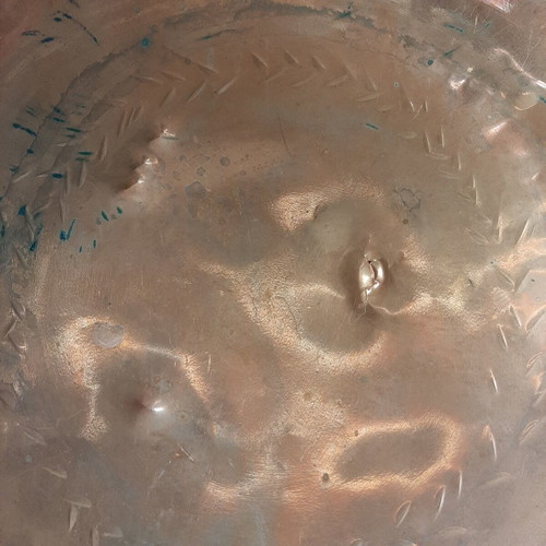 Large copper bowl used with carved details