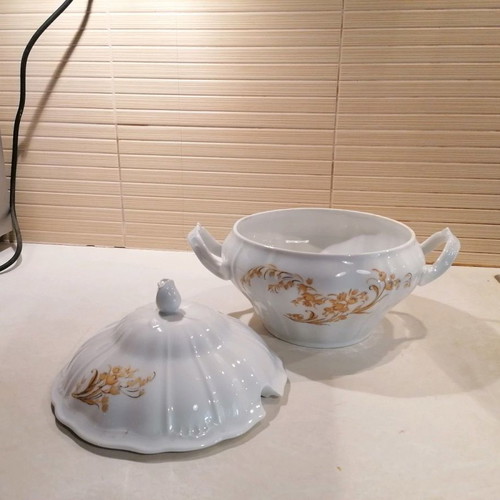Porcelain soup tureen used with gold floral details