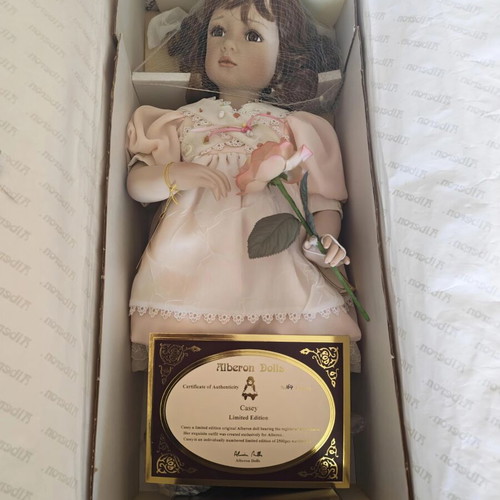 Alberon Casey porcelain doll with wooden stand, 50cm