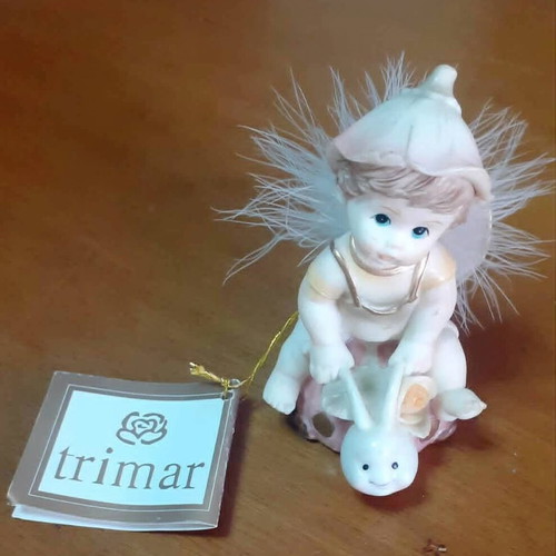 Vintage porcelain figurine Trimar baby angel on snail, like new