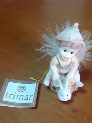 Vintage porcelain figurine Trimar baby angel on snail, like new