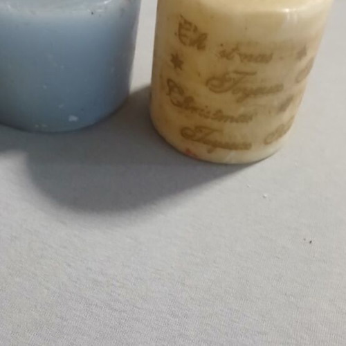 Set of 2 decorative candles with minor dents