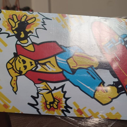 Children's skateboard with colorful comic design, sealed