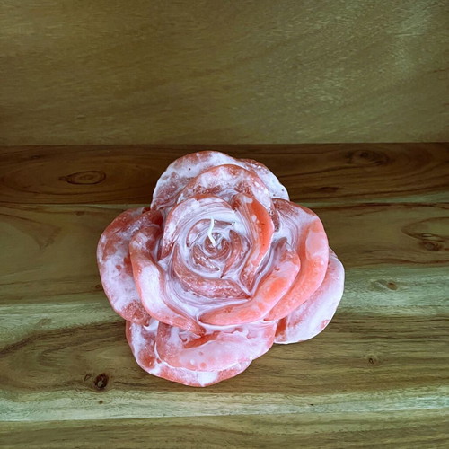 White and pink rose-shaped candle
