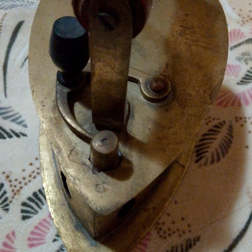 Vintage brass coal iron in golden tone, like new